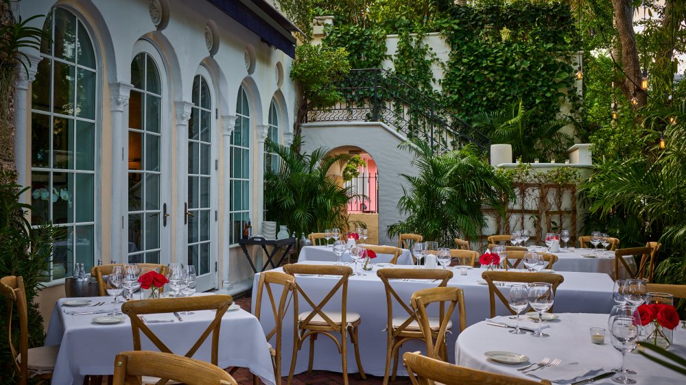 The East Garden patio at Casa Tua with its arched windows